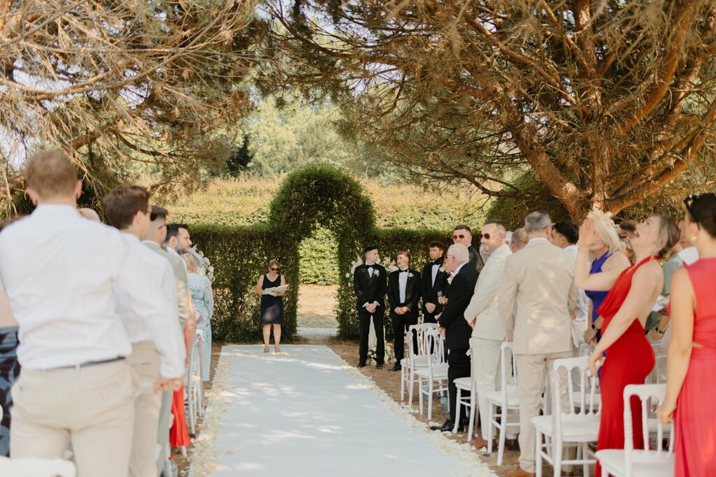 Groom waiting for the bride during the wedding ceremony at Domaine d'Essendieras by Jade Sequeval French Photographer