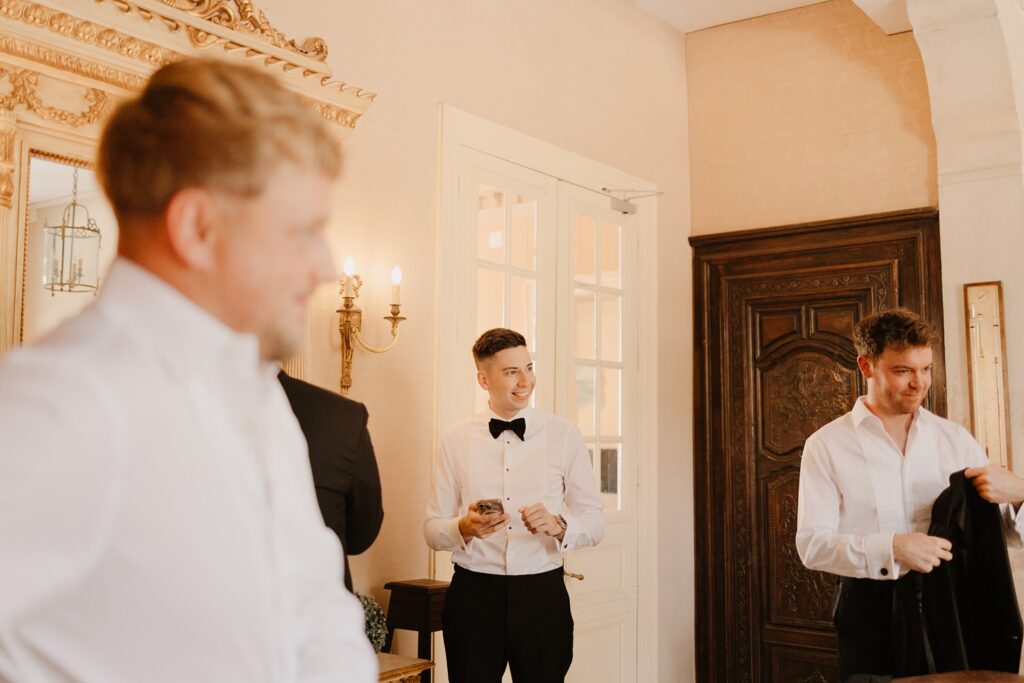 Groom in the old chateau at Domaine d'Essendieras by Jade Sequeval French Photographer