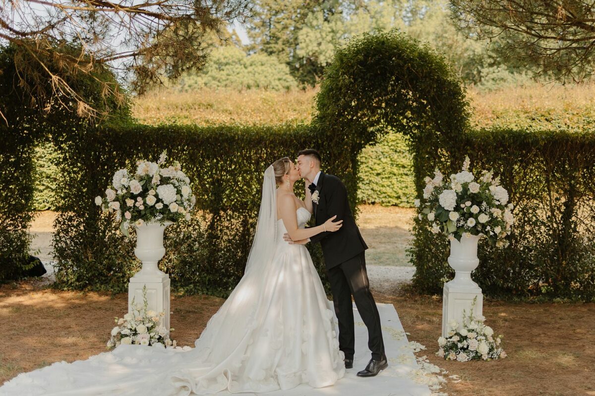 Bride and groom kissing at the end of ceremony at Domaine d'Essendieras by Jade Sequeval French Photographer