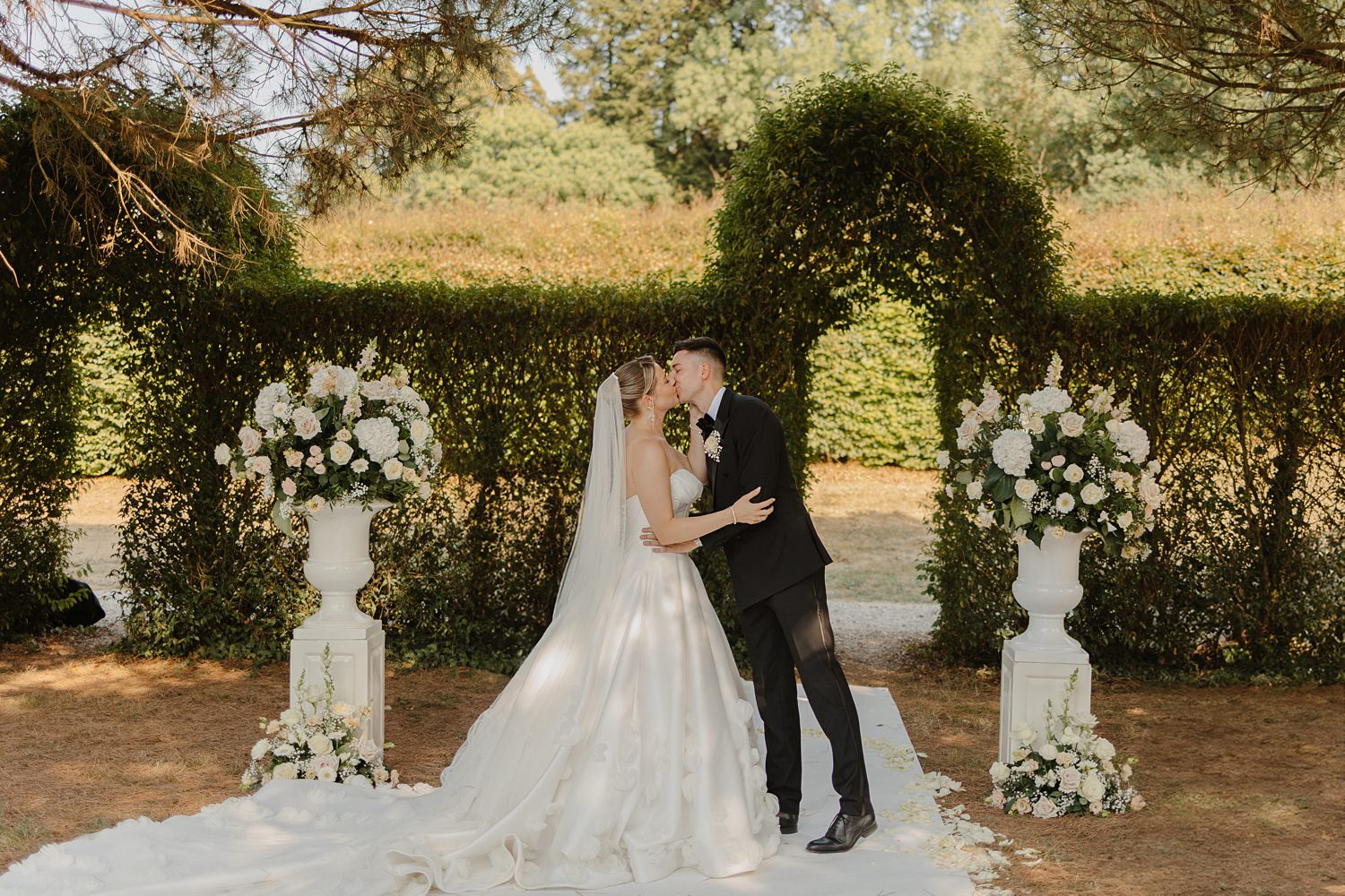 Bride and groom kissing at the end of ceremony at Domaine d'Essendieras by Jade Sequeval French Photographer