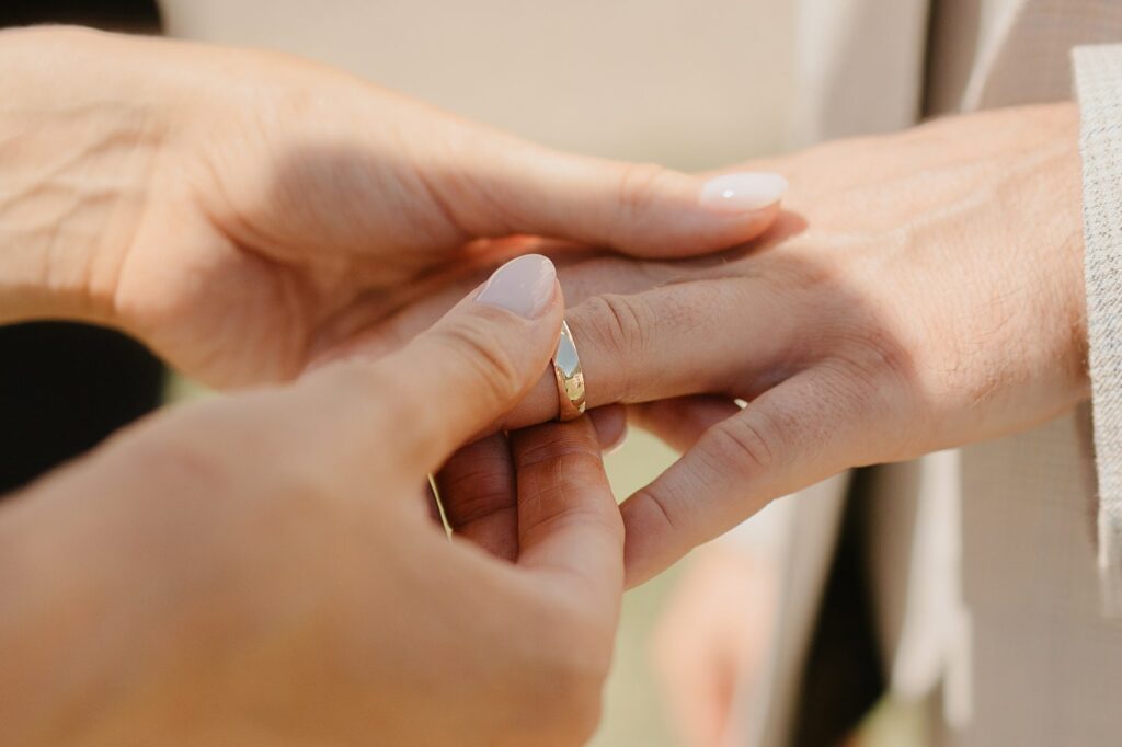 Exchanging rings at Chateau de Malliac - photo by Jade Sequeval wedding Photographer in South West France